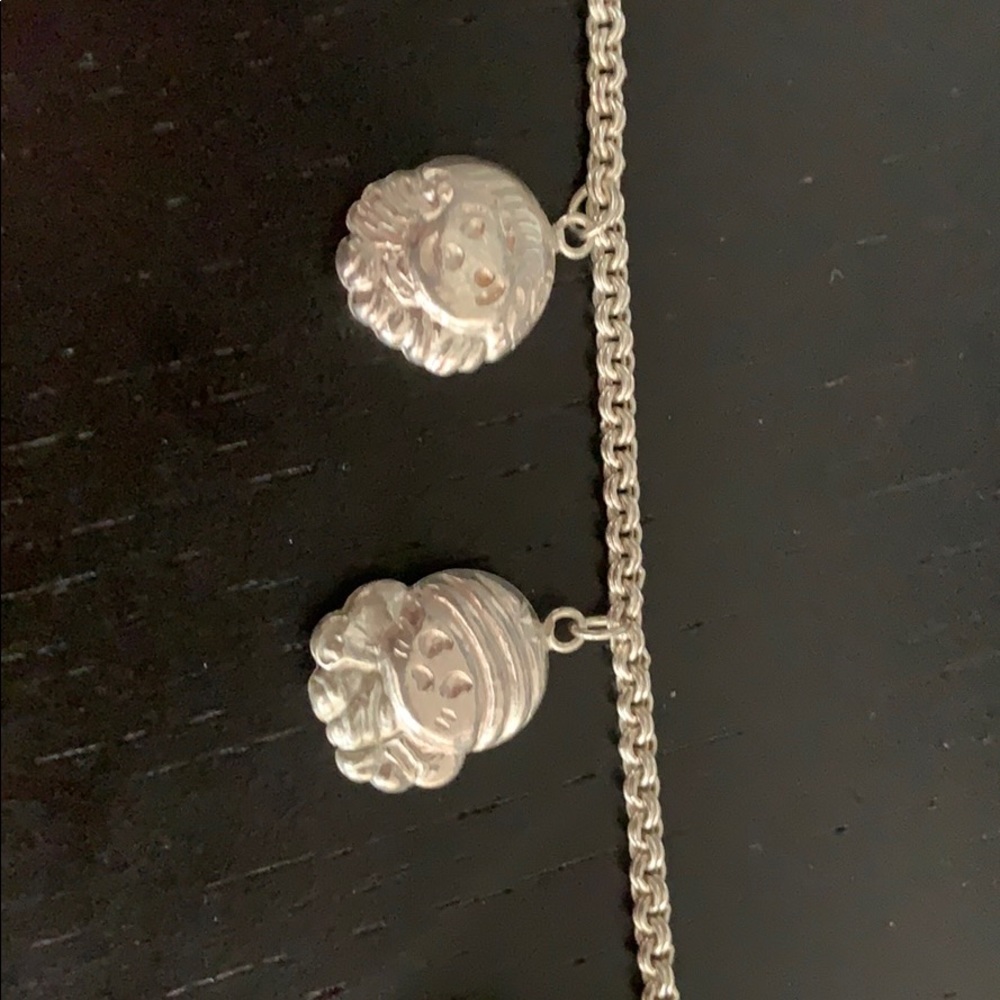 Cute sterling bracelet with 5 charms and 1 bell
